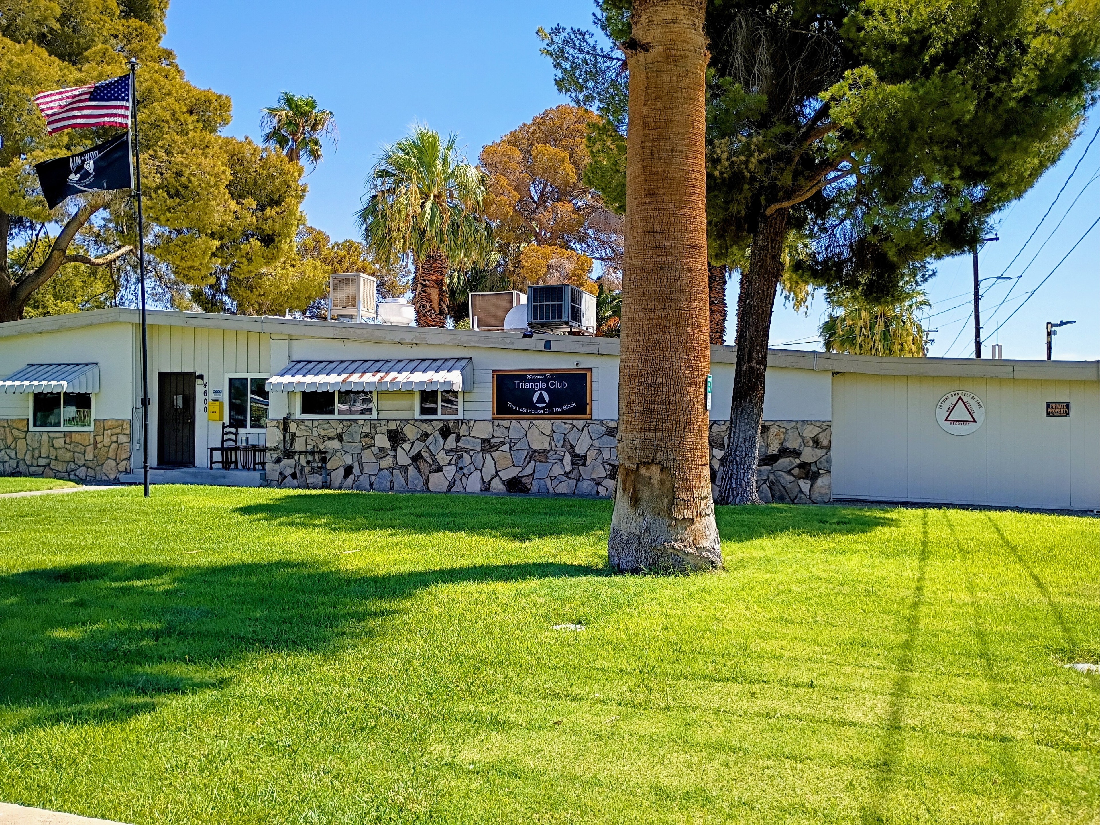 The Triangle Club clubhouse with flags outside